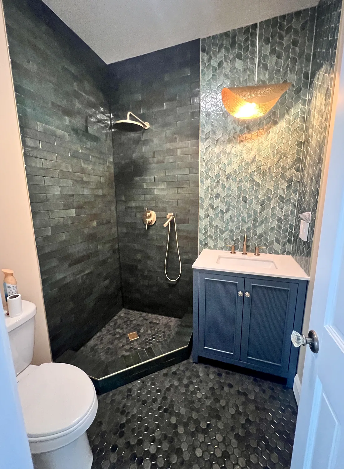 Dark green shower tile remodel in Charlotte NC with bathroom floor tile and vanity
